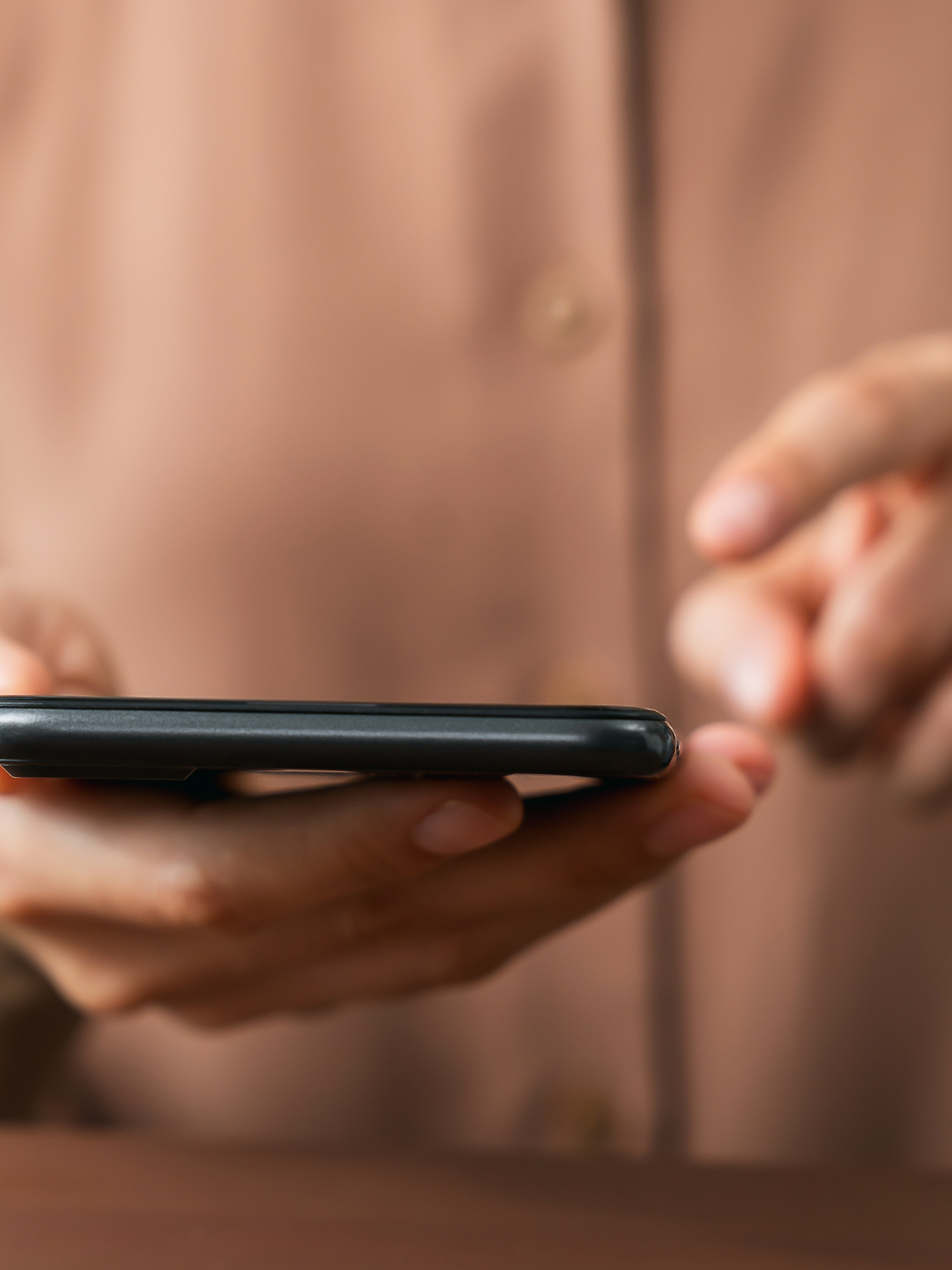 Essential Terms of  Social Media Manger contract - close up image of woman typing on phone