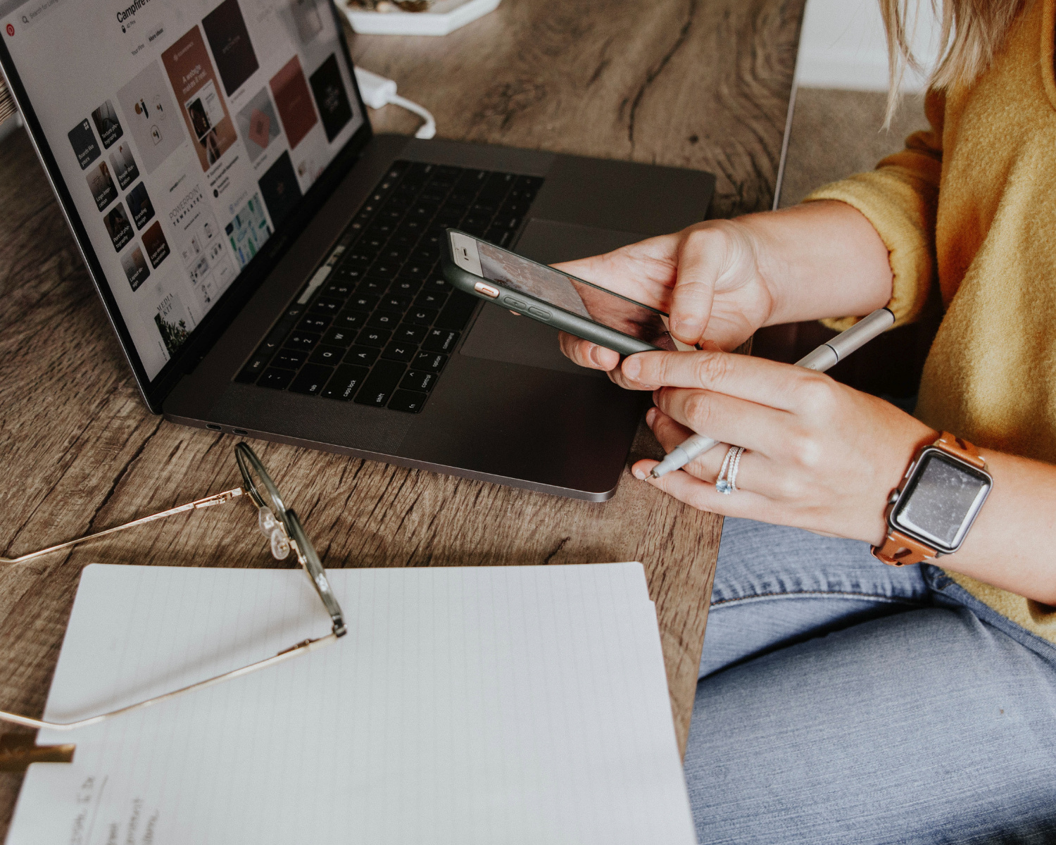 Female scrolling computer and googling "Should I incorporate my business" 